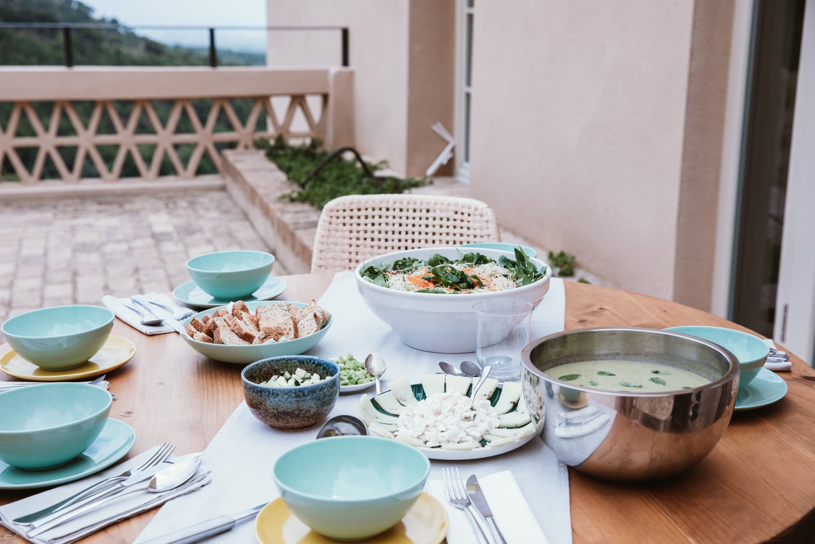 Lunch laid out on the terrace at Savi Coliving, Sierra Calderona behind